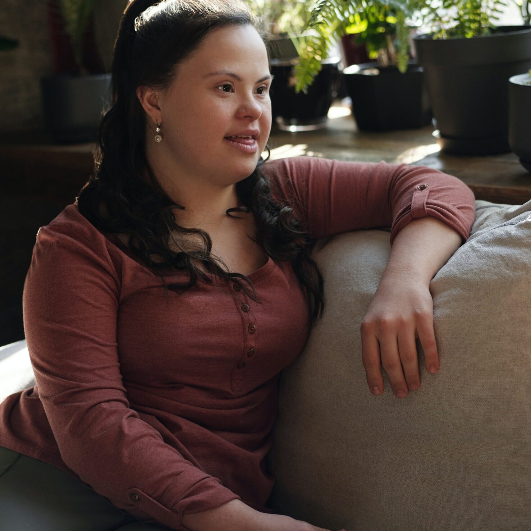 Down Syndrome Woman on Couch Pexels